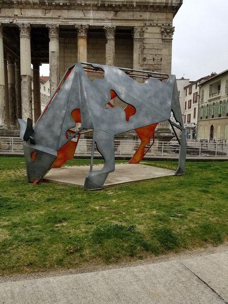 A modern art sculpture of a bull